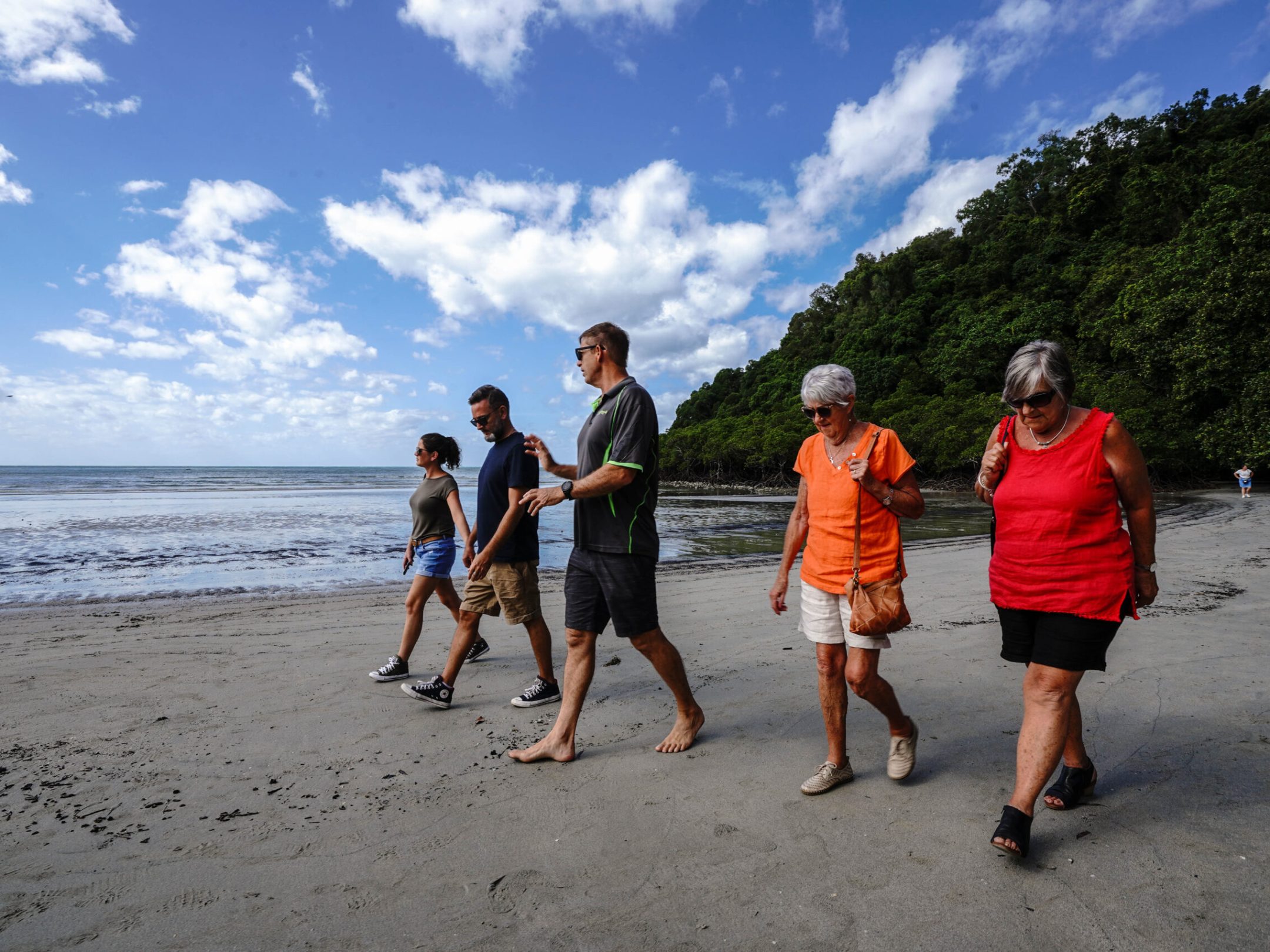 Walk along famous Cape Tribulation Beach where the rainforest meets the reef with Daintree Discovery Tours
