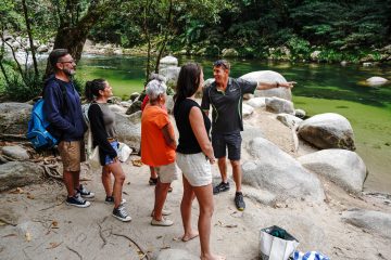 a group of people standing around a fire hydrant